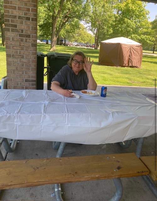 Man at outdoor picnic table park